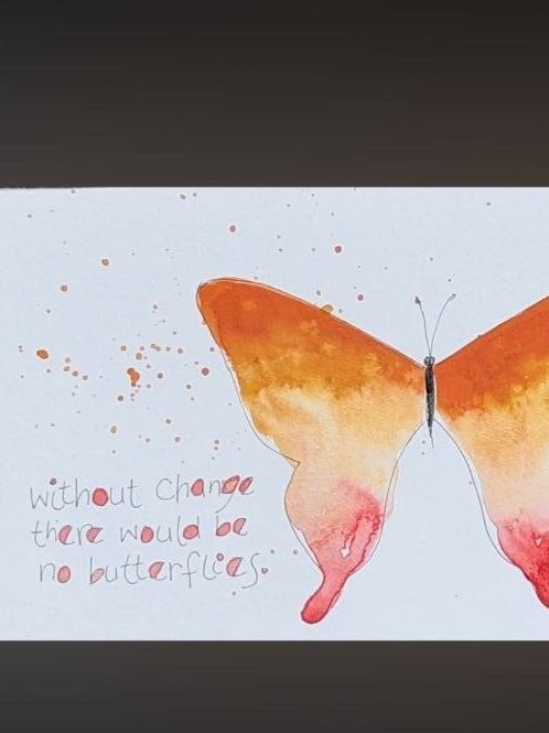 A watercolor butterfly in orange, cream, and blush pink with handwritten text about change.