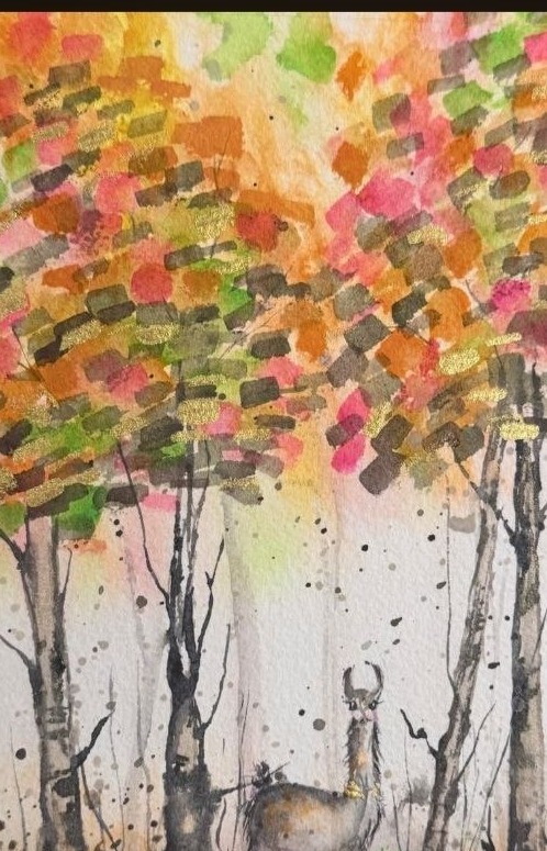 A deer- or llama-like animal standing in an autumn woodland beneath vivid orange and gold foliage.